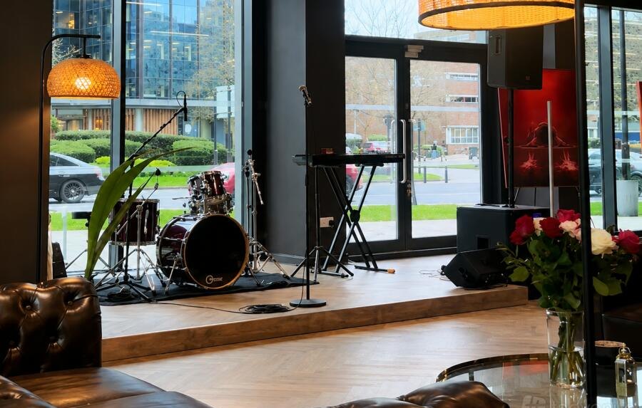 The Village Table interior with live music stage and park views
